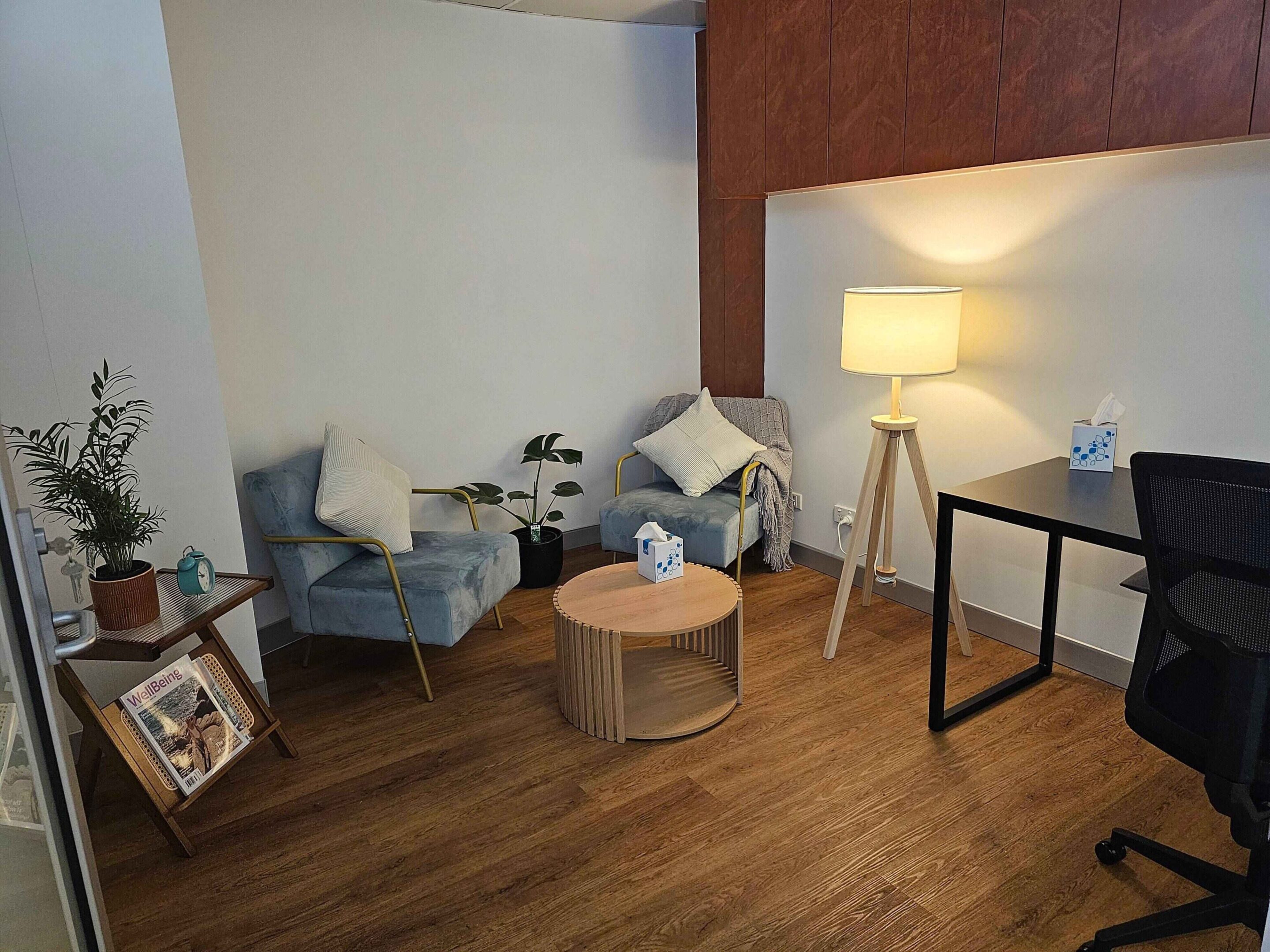 leasepage-img (1) A living room with wooden floors and white walls.